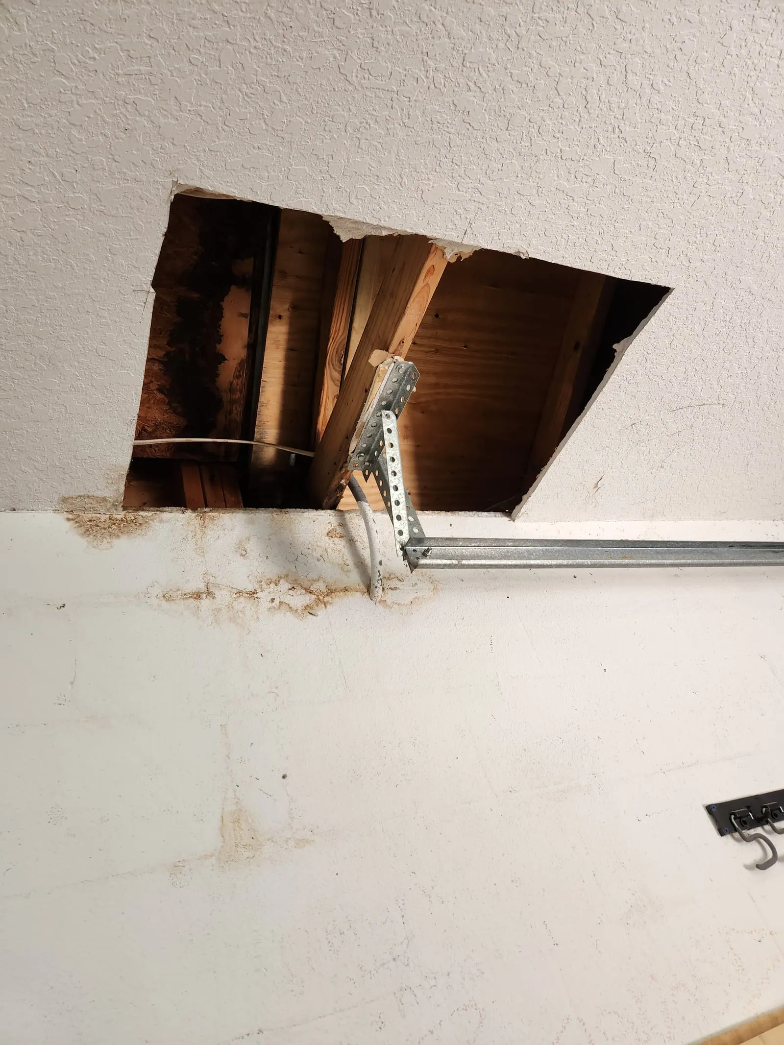 Garage ceiling before PalmPro drywall repair