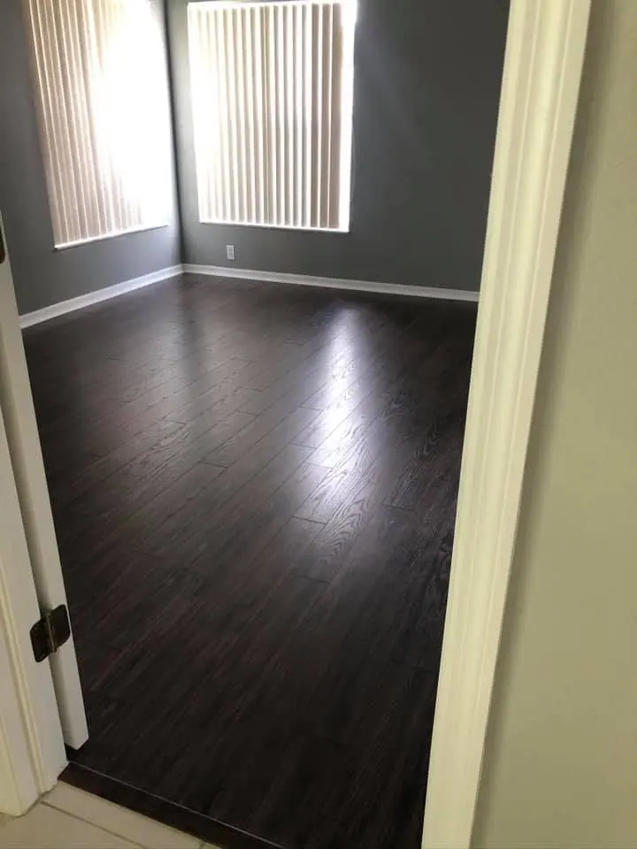 Finished dark laminate flooring installed by PalmPro
